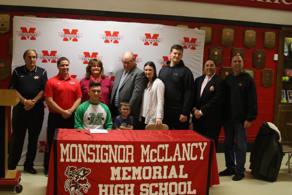 Kyle, his coaches and family at McClancy Wednesday.
